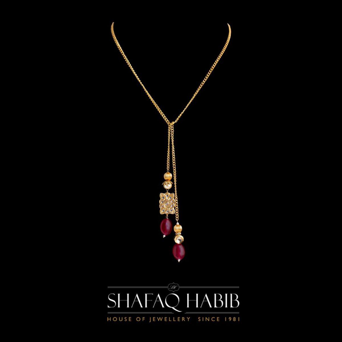 knot necklace in silver with ruby lite by Shafaq Habib