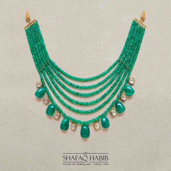 Shafaq Habib's Gold Necklace with Emerald, featuring a breathtaking emerald and glittering diamond polki available at the best online price in Pakistan