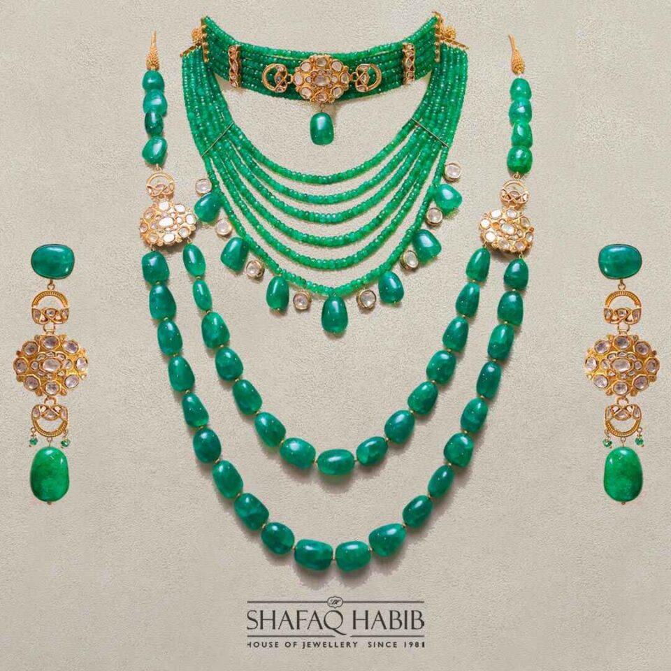 Shop the Shafaq Habib Zamurd collection for the perfect finishing touch to your bridal look - a stunning gold jewelry set adorned with green emeralds at the best online prices in Pakistan."