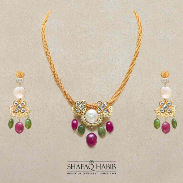 Pendant set in gold jewelry with kundan emerald & ruby stone by shafaq habib